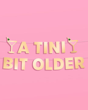 Tini Bit Older Banner - gold foil banner